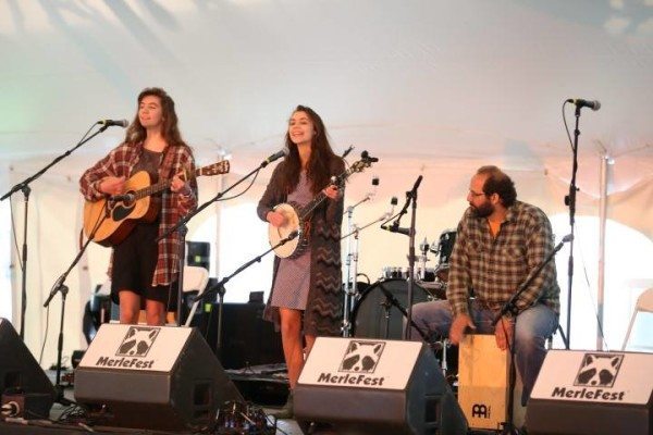 Acoustic Kids Showcase veterans, Silly Gals (Emmaly and Christina Saliga, backed up by their dad, Mark) of Pendleton, Ky., performing in the 2015 Saturday morning showcase. The Saligas have been a part of Acoustic Kids Showcases at MerleFest since 2011. Now that Emmaly has aged out of the Acoustic Kids Showcases, she will join her dad as an accompanist to Christina Saliga.