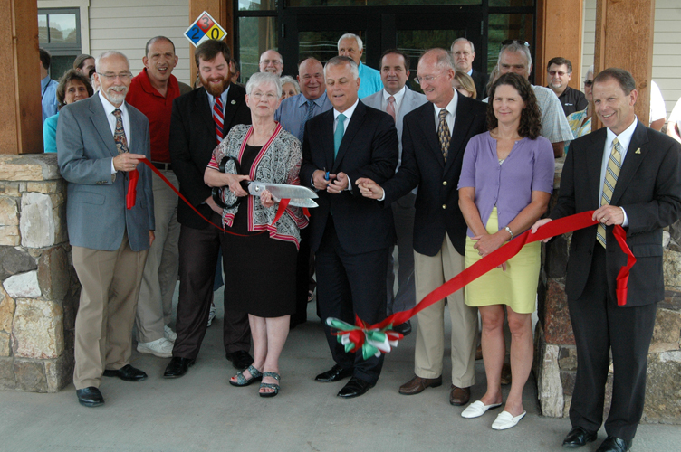 (Left to right) AppalCART Transportation Director Chris Turner, Boone Town Council Member Andy Ball, Boone Mayor Loretta Clawson, NCDOT Secretary Tony Tata, AppalCART Board Chair Jerry Moretz, AppalCART Board Member Angie Boitnott, and ASU Vice Chancellor of Business Affairs Greg Lovins participate in the ribbon cutting. Photo by Jesse Wood