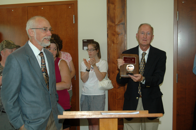 AppalCART Transportation Director gives Board Chair Jerry Moretz an award of appreciation for his service. Photo by Jesse Wood