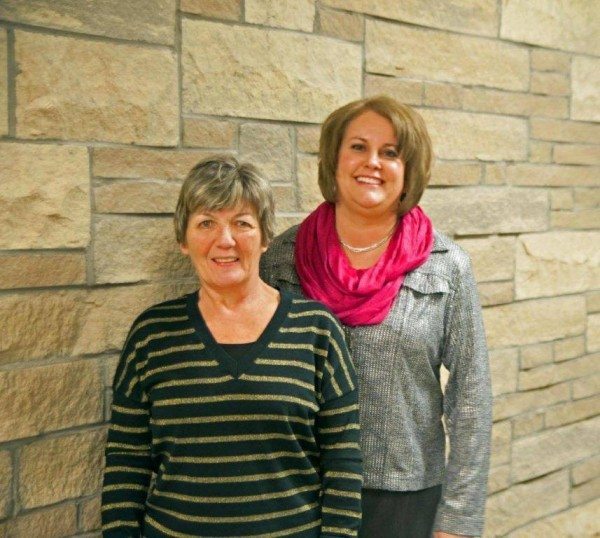 Recently-retired Watauga County Register of Deeds Jo Ann Townsend (left) stands with her successor Amy Shook after Shook was sworn in on Monday. 