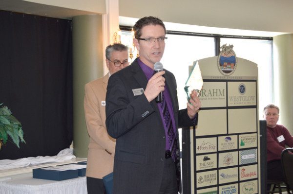 Blowing Rock Town Manager Scott Fogleman accepts the chamber's Commercial Renovation Ward on behalf of the American Legion Hall.