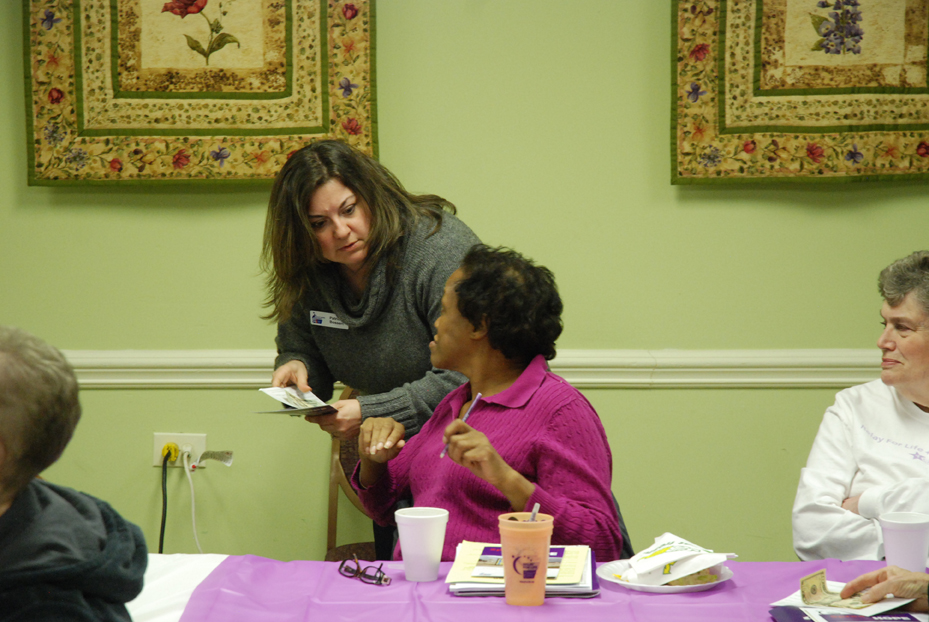 Bossert helps an attendee get signed up for Relay 2013.