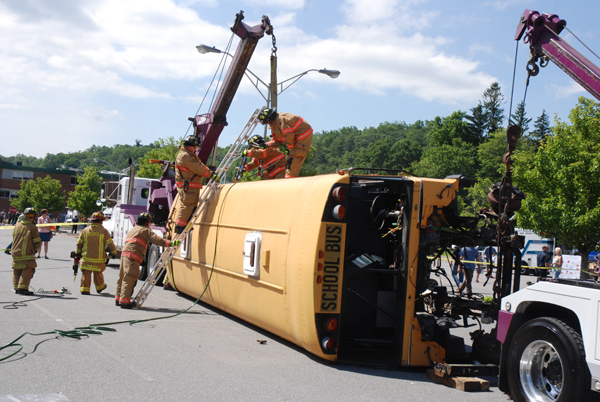 Firefighters enact an emergency situation involving a bus.