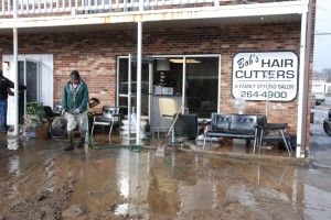 Cleanup efforts began at Bob's Hair Cutters and other businesses along Boone Docks Drive last Thursday and continue still. Photo by Ken Ketchie