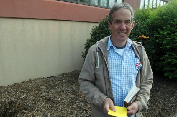 Frank Veno, representing the Watauga County Democratic Party, stood in front of the Agricultural Center passing out "Pam's Picks."
