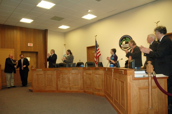 Boone Town Council members and staff give retiring manager Greg Young a round of applause on Thursday evening. Photo by Jesse Wood