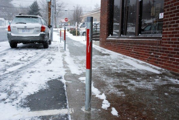 As seen on Depot Street, poles for the parking meters have been installed. Full implementation of metered parking in Boone is still two to three months away. Photo by Ken Ketchie