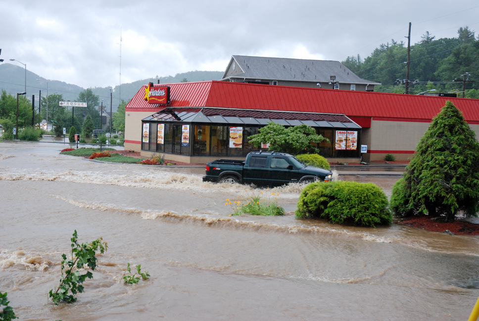 Hardee's parking lot in Boone experienced flooding on Sunday. Photo by Ken Ketchie