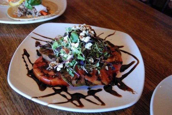 A dish from Pepper’s at last year's High Country Small Plate Crawl. Tomato Salad: stacked heirloom tomatos, crumbled bacon, micro greens, goat cheese, drizzled with homemade balsamic vinaigrette.