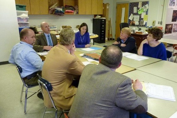 Board of Education members at Hardin Park School with Dr. Scott Elliott (at far end of table on left), Principal Mary Smalling (far end on right), and central office personnel