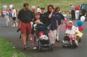 Image is attached of Luke Hancock, 2001 Banner Elk July Fourth Parade with the McKays and Hardins. He took the prize for best float for children and won a bag of cookies. Kathy Boone is in the far left upper quarter. Mike, Pam, Morgan (On the motor cycle) Mason (in the stroller).  Susan and Ed Hardin are behind us. 