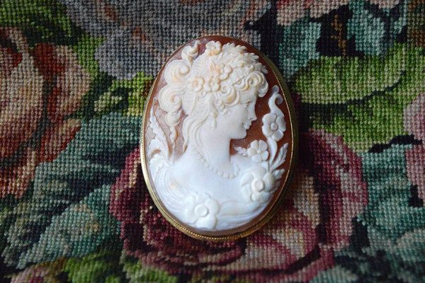 Italian hand-carved shell cameo in 18K yellow gold with a hinged pendant ball and pin. Photo courtsey of Old World Galleries.