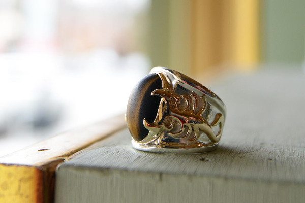 OWG's Morgan Shaw revitalized this men's tiger's eye ring, restoring its intricate details and breathing life back into this family heirloom for the client. Photo courtesy of Old World Galleries.