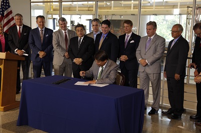 McCrory signing the fracking bill on Wednesday. Courtesy Governor's Office