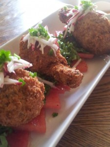 Bacon wrapped southern fried chicken with watermelon, local radish, and jalapeno vinaigrette.