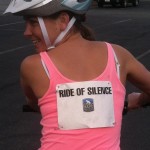 A rider shows off the Ride of Silence bibs that the cyclists wore.