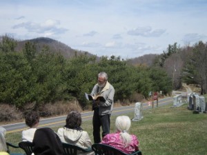 Congregation meets outside to hold service due to being locked out. 