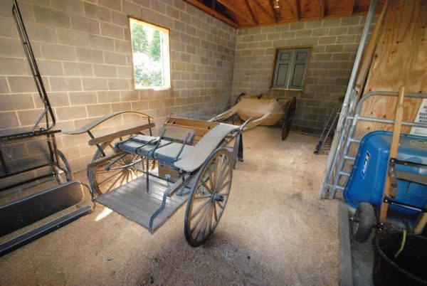 The interior of the barn, which will eventually become an open event hall with brick paver floors.