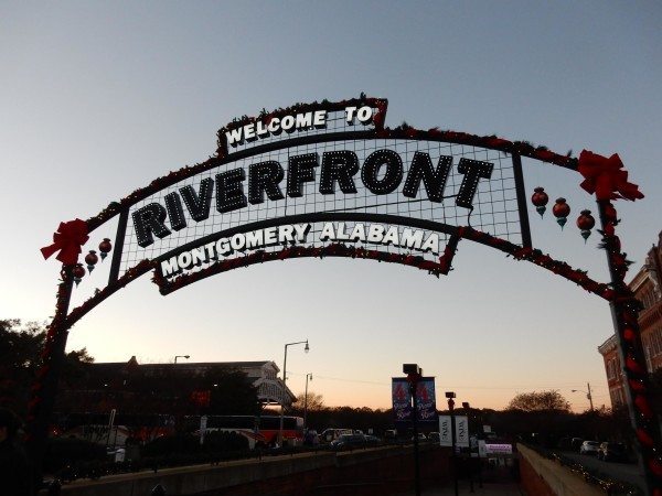 The sun sets behind the Riverfront signage prior to the Mountaineers and Bobcats gridiron meeting at the Camellia Bowl.