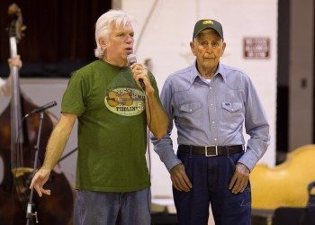 Rodney Sutton (left) introduces Robert Dotson at an event in the old Cove Creek School in Sugar Grove this past fall. Photo by Lonnie Webster